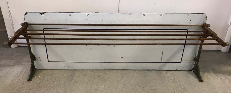 A large enamel backed vintage metal kitchen shelf.