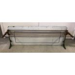 A large enamel backed vintage metal kitchen shelf.