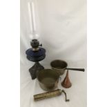 A vintage oil lamp and brassware.