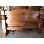 A solid pine Queen size bed.