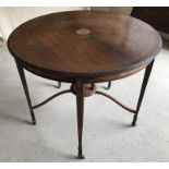 A Victorian inlaid occasional table with tapered legs and central column support.