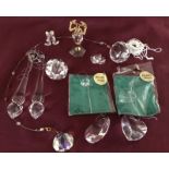 A collection of crystal figurines and hanging decorations.