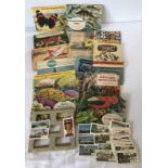 A collection of cigarette card and tea albums.
