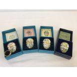 4 boxed Halcyon Days enamelled eggs by Bilston and Battersea enamels.