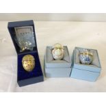 3 boxed Halcyon Days enamelled eggs by Bilston and Battersea enamels.
