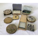 A collection of vintage compacts and ladies items.