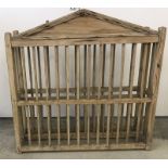 An Antique pine hanging plate rack.