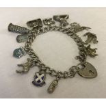 Silver charm bracelet with 'padlock' clasp and safety chain.