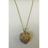Heart shaped 9ct gold locket with engraved pattern to front & 'Love you always' on the reverse.