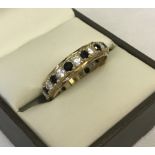 9ct gold full eternity ring set with alternate sapphires and clear stones.