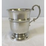 A small silver handled cup / tankard.