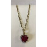 9ct gold pendant set with a large heart shaped created ruby.