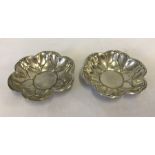 A pair of American silver pin dishes.
