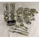 A collection of silver plated items to include goblets and salts.
