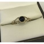 9ct gold ring set with onyx cabochon.
