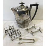 A silver plates teapot with Deco style handle.
