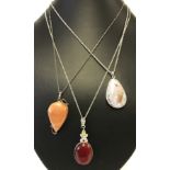 3 natural stone/agate pendants on silver chains.