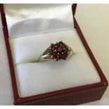 Hallmarked 9ct gold garnet cluster ring.