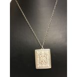 A heavy 925 silver ingot with Celtic knot designs to front & back on silver chain.