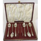 A cased set of 6 vintage EPNS coffee spoons with sugar tongs.