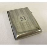 A small silver cigarette case, hallmarked inside with engine turned decoration and M monogram.