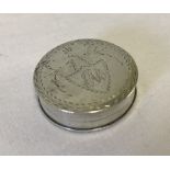 A Georgian silver bright cut round pill box / patch box.