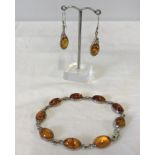 A matching amber & silver bracelet and amber & silver drop earrings.