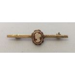Hallmarked 9ct gold bar brooch with central mounted cameo.