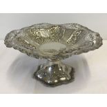 English antique silver cake stand, with floral decoration and pierced rim.