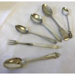 5 assorted silver spoons together with a silver cocktail fork with mother of pearl handle.