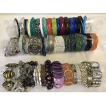 A collection of costume jewellery bangles and bracelets.