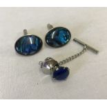 Silver cufflinks with blue enamelled decoration and matching tie pin.