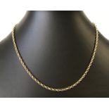 A 16" 9ct gold rope chain.