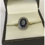 18ct gold diamond and sapphire cluster ring.