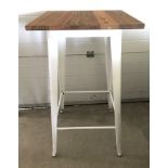A modern wine bar style table with pressed steel frame and solid elm wooden top.