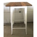 A modern poseur / bar table with pressed steel frame and solid elm wooden top.