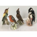 A collection of 4 ceramic Goebel birds to include a Bee eater and Waxwing.