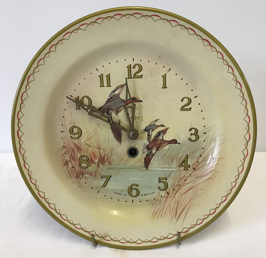 A Vintage Smiths tin plate wall clock with ducks in flight decoration to front.