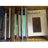 A box of Sotheby's Auction catalogues.