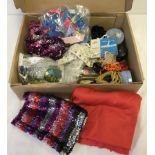 A box of dressmaking items for dance dresses.