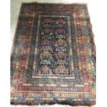 A Samarkand wool patterned rug in gold, red and blue colours.