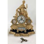 A French gilt mantle clock of decorated with the figure of Liberty to top with hand painted panels.