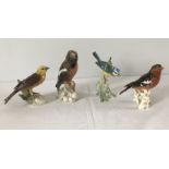 A collection of 4 ceramic Goebel birds to include Yellow Hammer and chaffinch.