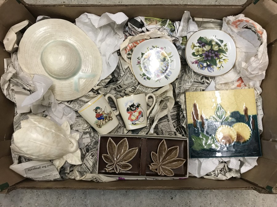 A box of assorted ceramics.