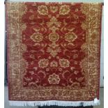 A Ziegler rug with red coloured background design.