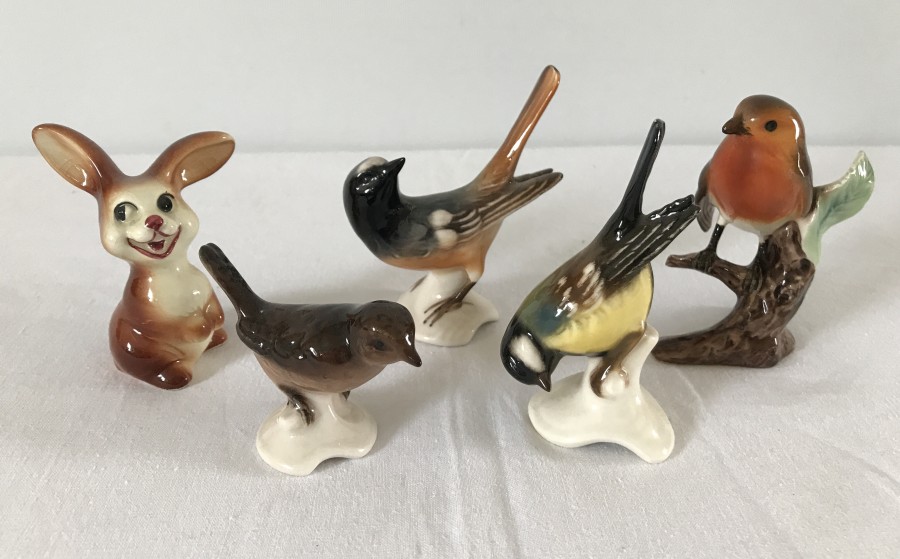 A collection of 4 Goebel ceramic birds together with a ceramic Goebel rabbit.