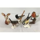 A collection of 4 Goebel ceramic birds together with a ceramic Goebel rabbit.