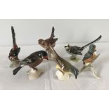 A collection of 6 Goebel ceramic birds.