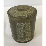 An decorative Indian brass lidded cigarette box, with elephant design to lid and engraved panels.