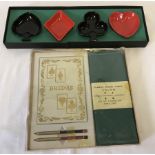 A vintage boxed bridge set together with a boxed set of Carlton Ware ceramic card suit dishes.